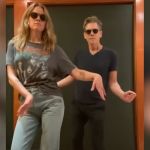 Actor Kevin Bacon does a silly dance with his daughter.