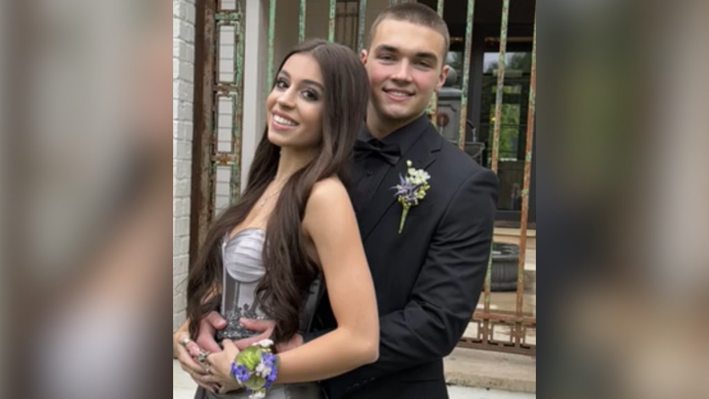 Melissa Joan Hart's son, Mason, smiles as he poses with his prom date, Sabrina, outside.