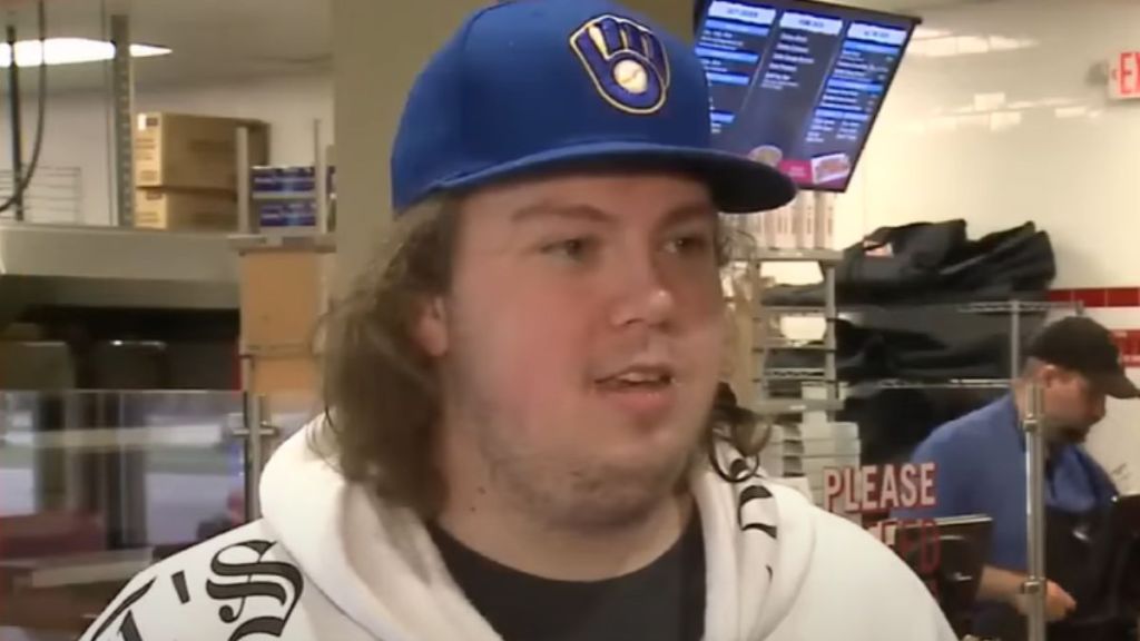 A pizza guy wearing a Taylor Swift hoodie.