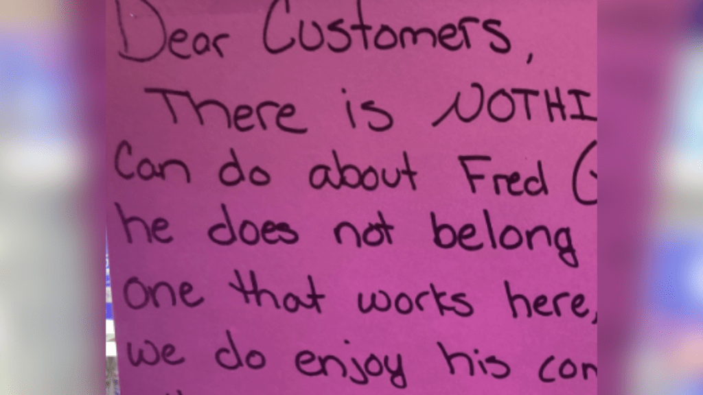 A note to customers from a dollar store warning them about the rooster who frequents the store