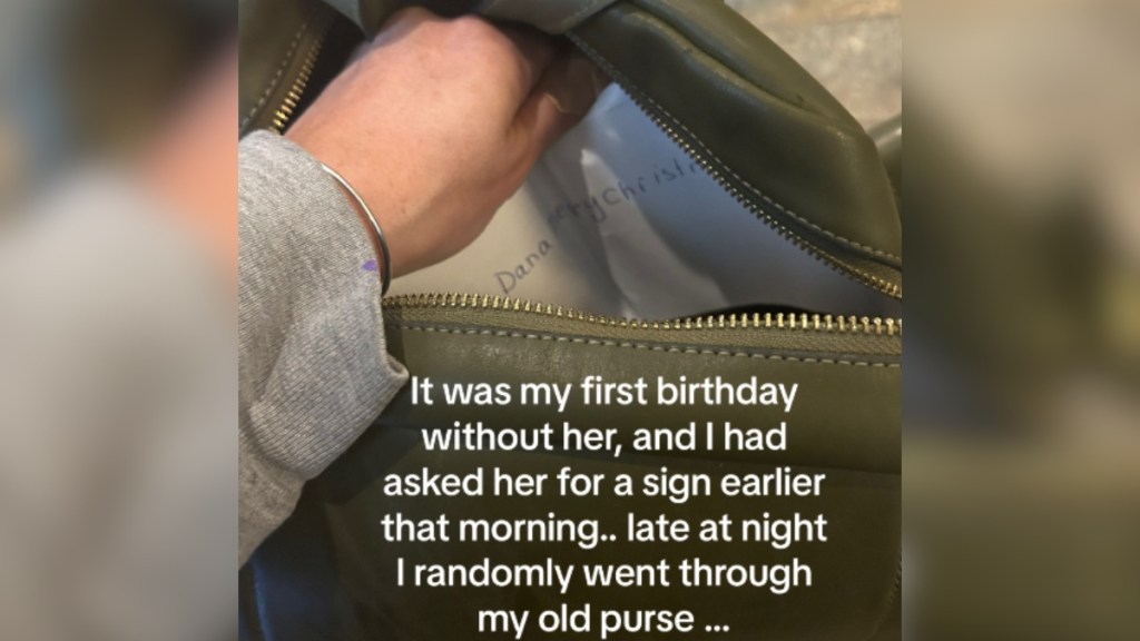 A woman is reaching into a purse, starting to grab something we can't quite see. Text on the image reads: It was my first birthday without her, and I had asked her for a sign earlier that morning.. late at night I randomly went through my old purse...