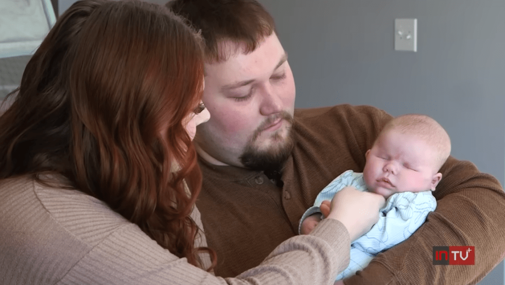 Taylor and Robert with their newborn daughter