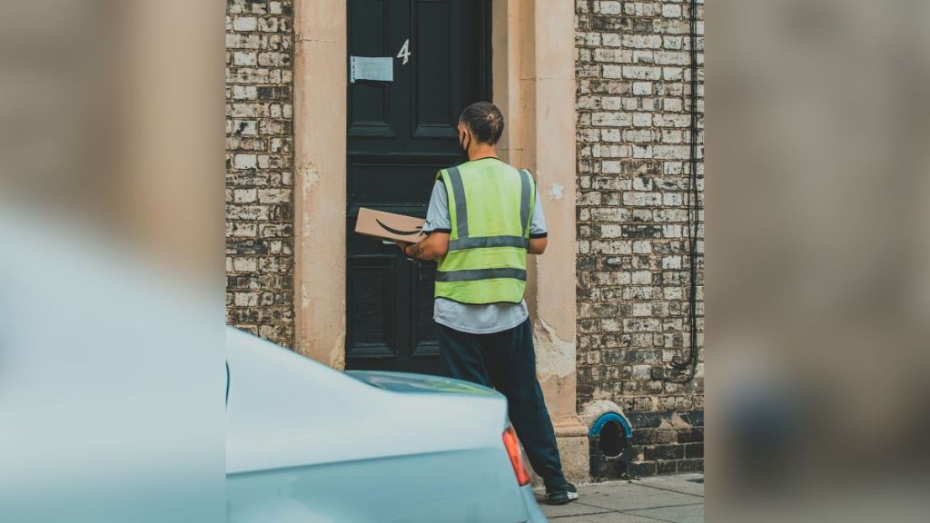 A delivery driver dropping off a package.