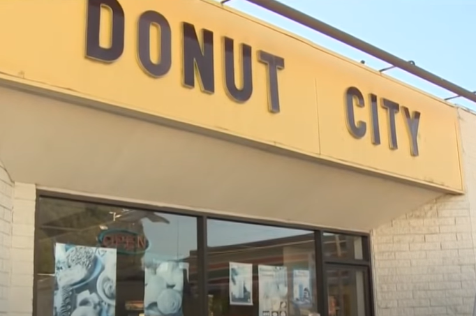 A donut shop called "Donut City" with the name on the front.