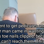 An elderly man at a nail salon getting a pedicure.