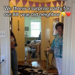 An elderly woman is shocked when she sees her surprise party.