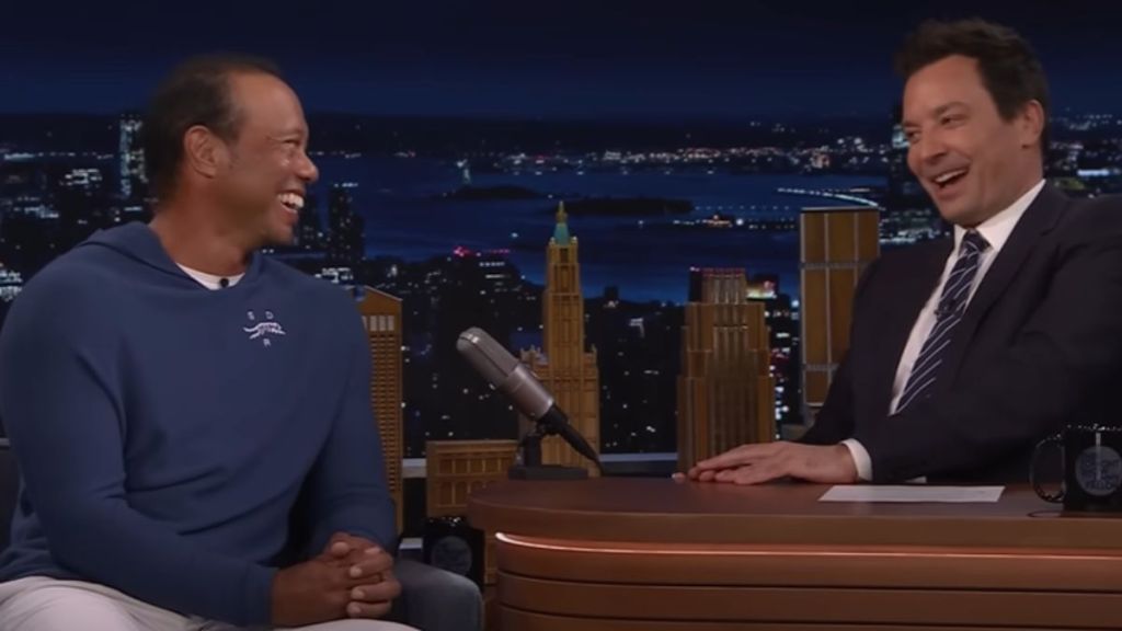 Tiger Woods and Jimmy Fallon laughing together.