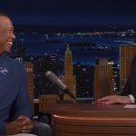 Tiger Woods and Jimmy Fallon laughing together.