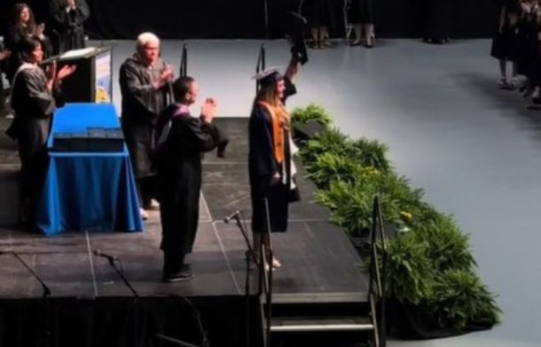 Kadyn Mackey accepts the diploma for her deceased friend, Jenna Howard to a standing ovation.