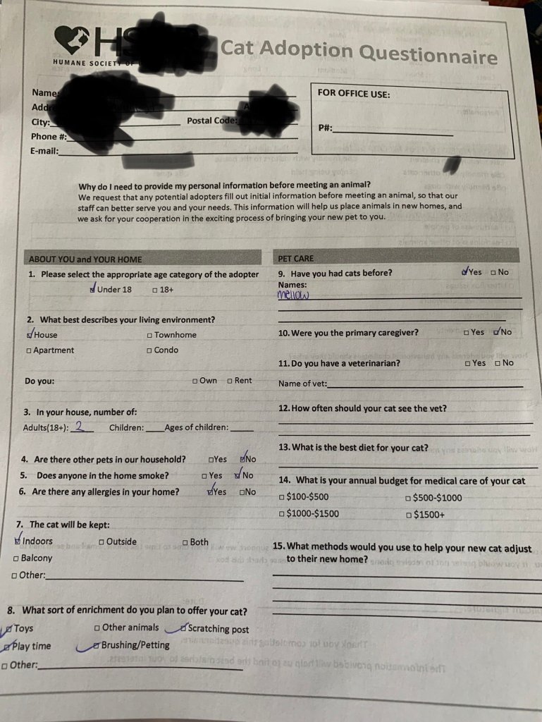 Partially filled out papers to adopt a cat.