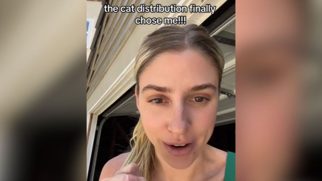 An excited woman talks into the camera.