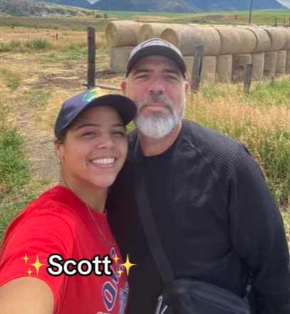 Fallon and dad Scott smile for a selfie outside.