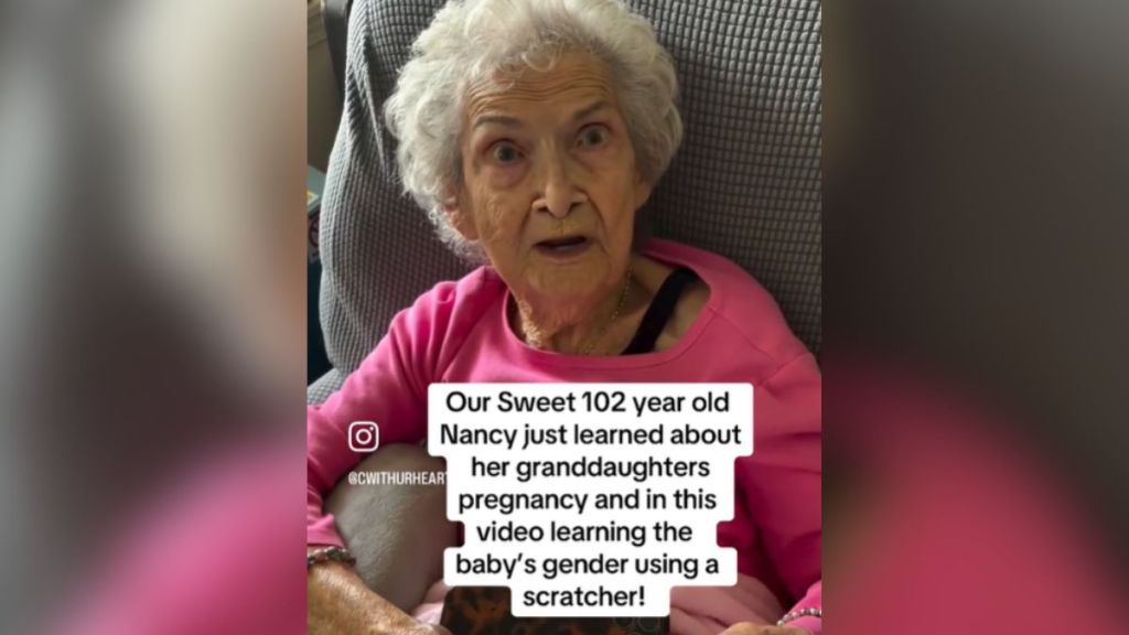 An elderly woman has a surprised expression on her face.