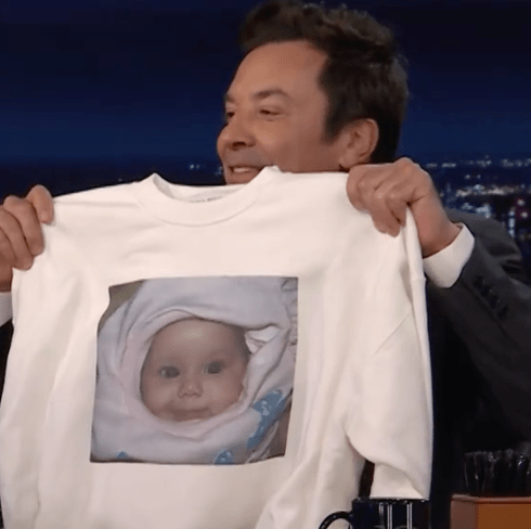 jimmy holding ariana sweatshirt