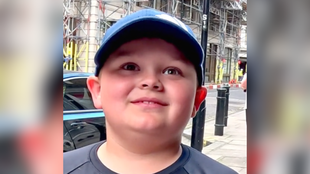 little boy in baseball hat
