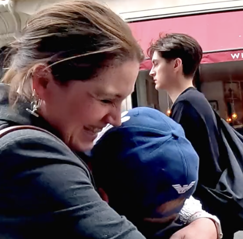 mom hugging little boy