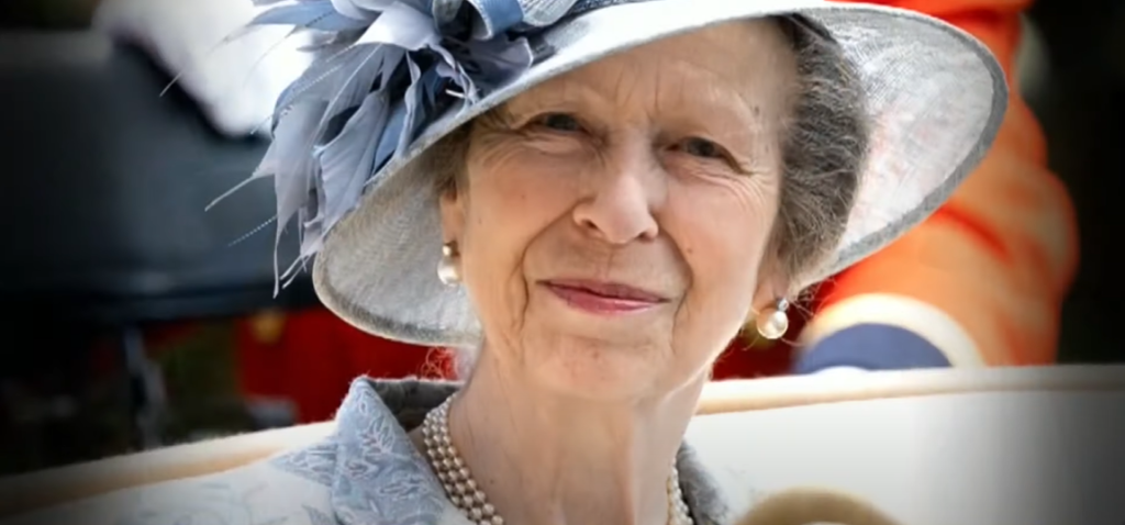Close up of Princess Anne smiling warmly at the camera.