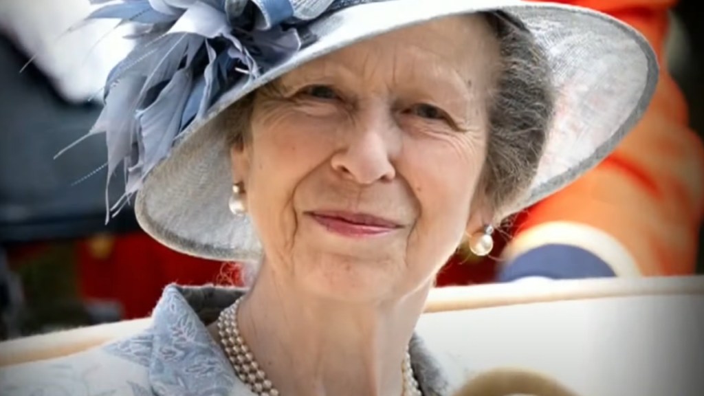 Close up of Princess Anne smiling warmly at the camera.