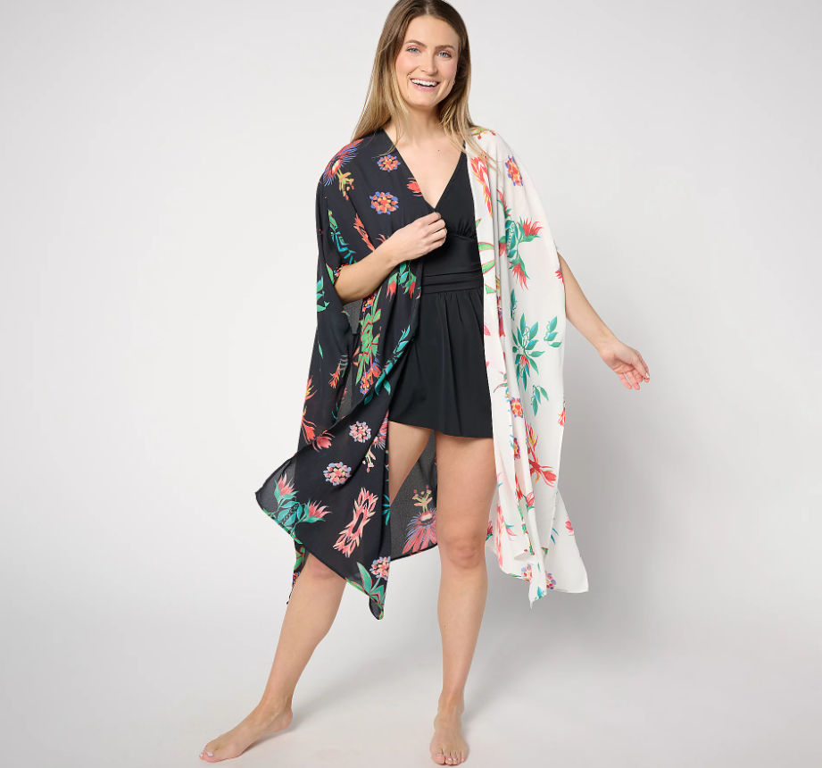 A woman wearing a cover up over her swimsuit.