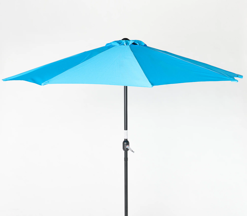 A light blue patio umbrella against a light background.