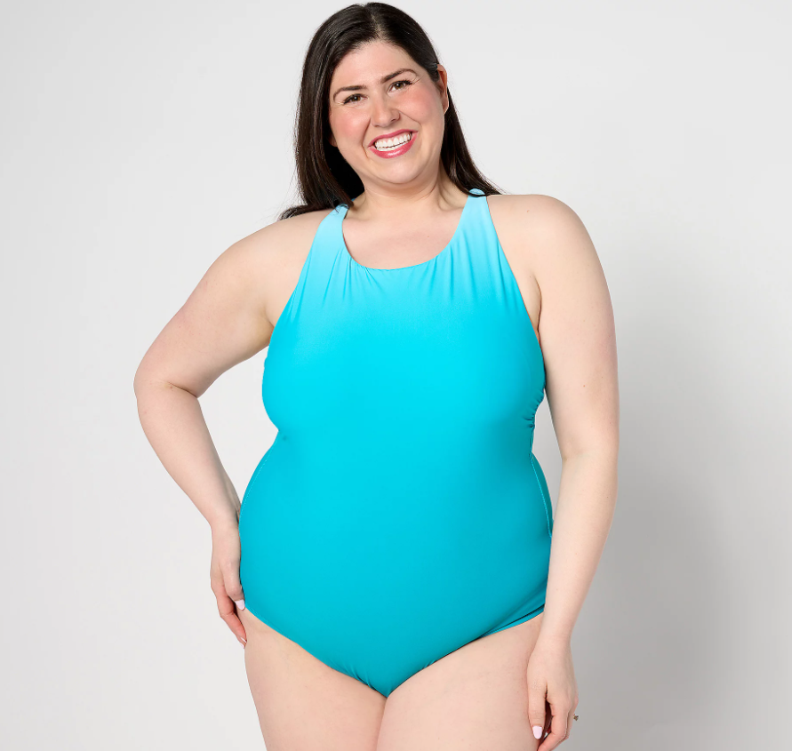 A woman wearing a light blue, one-piece swimsuit.