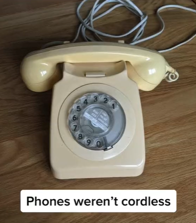 A rotary phone with a cord from the 1980s.