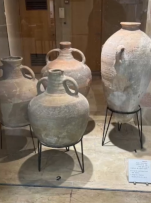 Four jars, each centuries old, on display at a museum