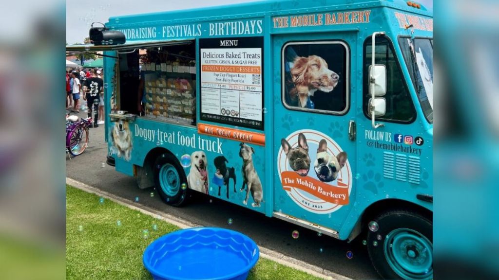 Image shows the dog food truck that caters to canines with homemade dog treats.