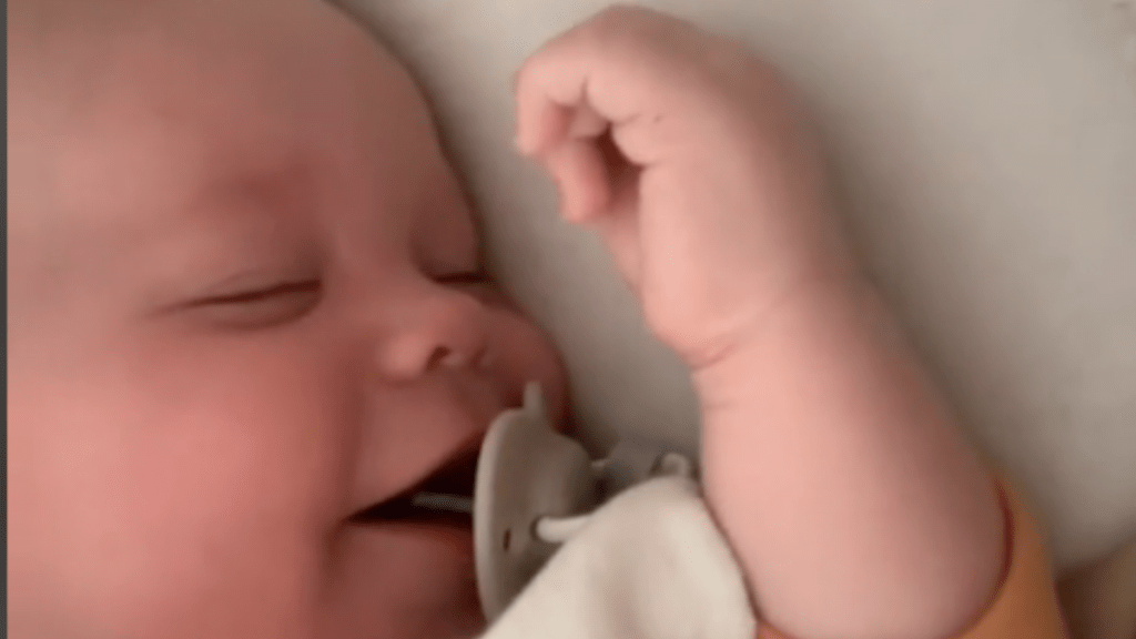 baby laughs while he sleeps