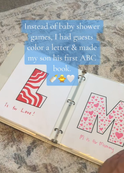 A coloring book binder with the letters "L" and "M."