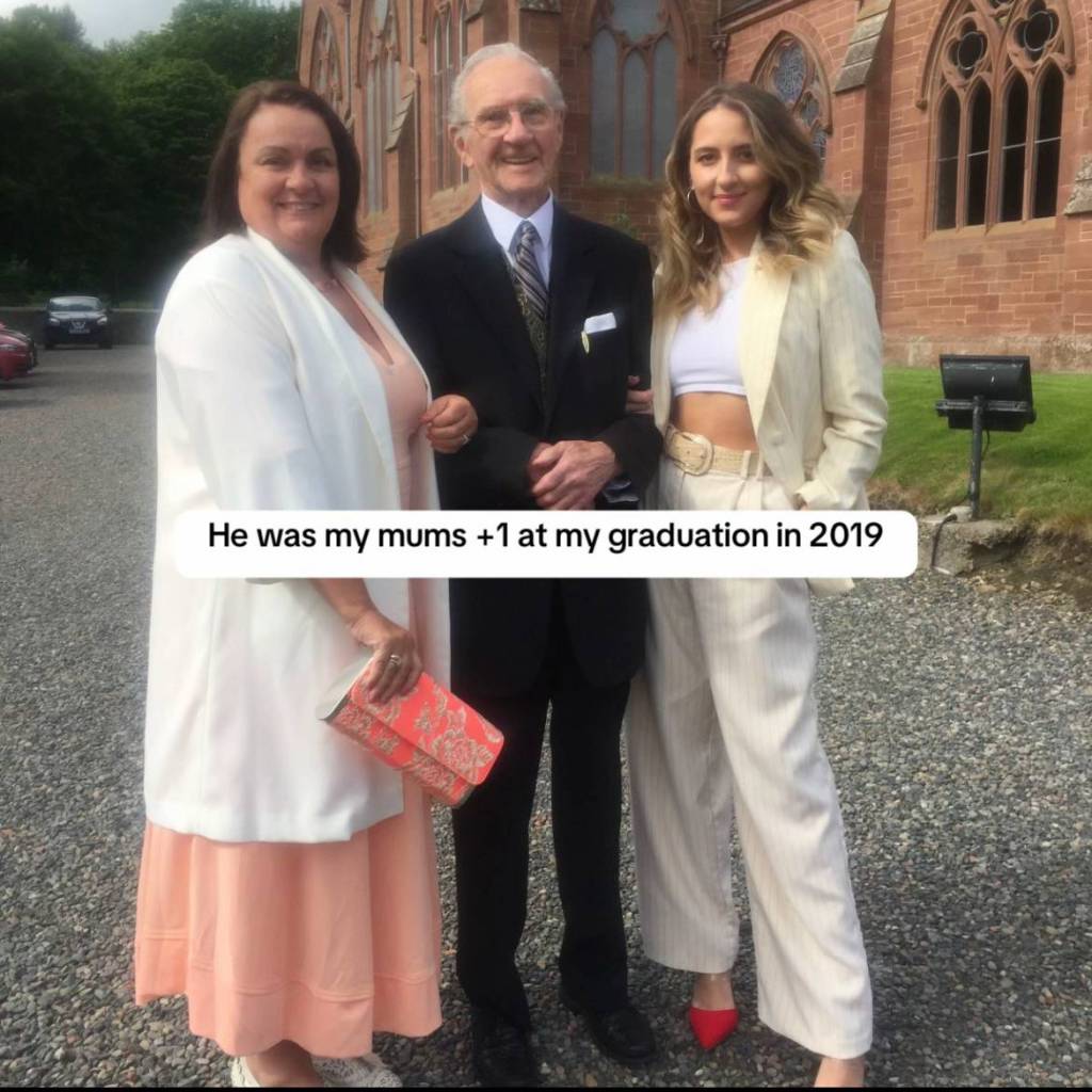 Aoife and Tommy smile and poses for a photo outside with Aoife's mom. 

Text on the image reads: He was my mums +1 at my graduation in 2019