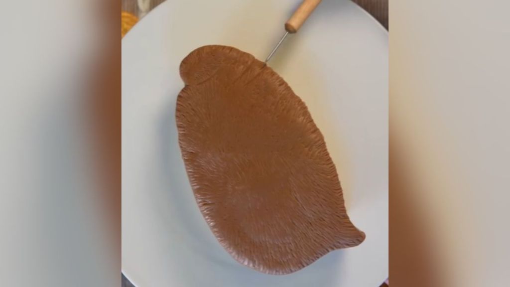 A cake shaped like a baby penguin.