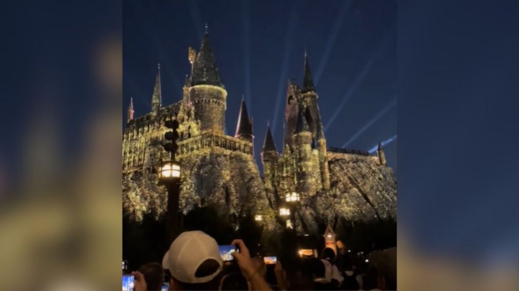 Hogwarts castle illuminated at night.