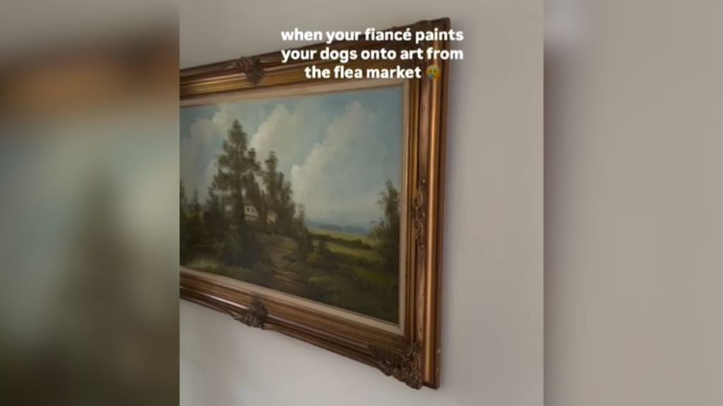 A framed landscape painting on the wall.