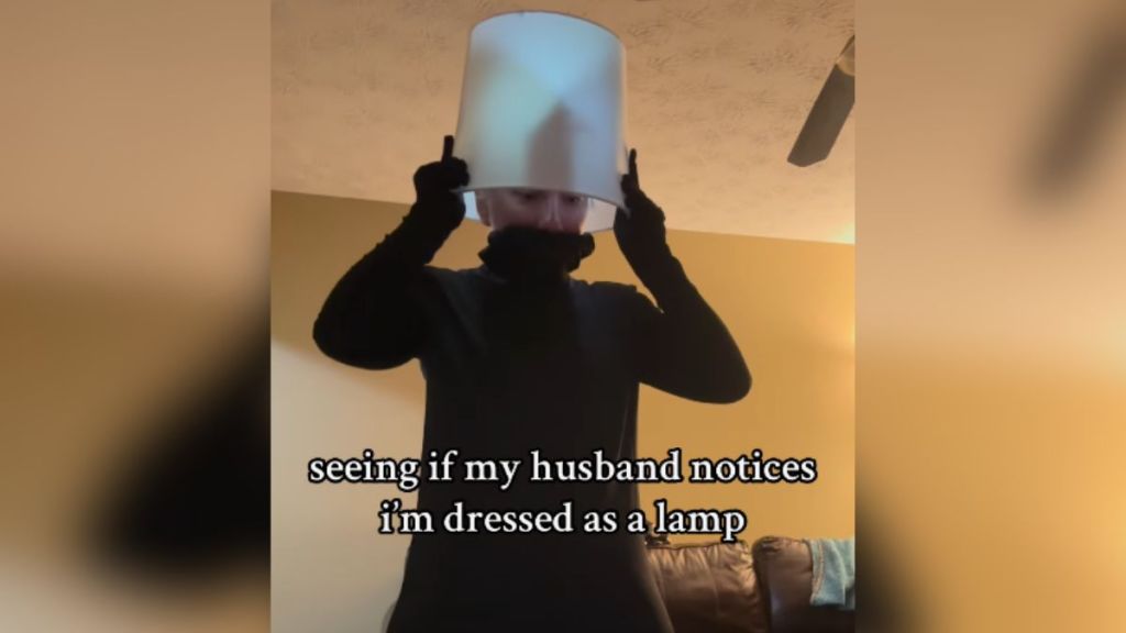 A woman dressed as a lamp.