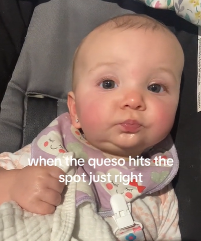 A baby tasting something new for the first time.
