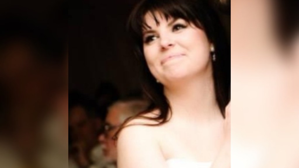 Close up of a smiling woman wearing a wedding dress