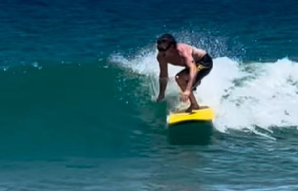Surfer Kai McKenzie returns to surfing after losing his right leg to a shark.