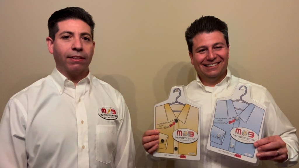 Michael and David Puglia smile as they show off two containers of The Magnetic Button.