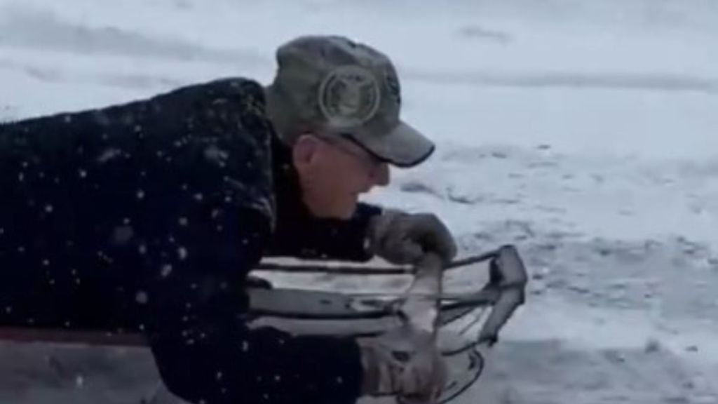 Image shows an 80-year-old man enjoying a sled ride.