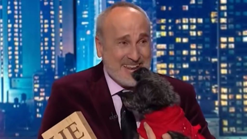 Stephen Knight, CNN's Hero of the Year, holding a small dog.