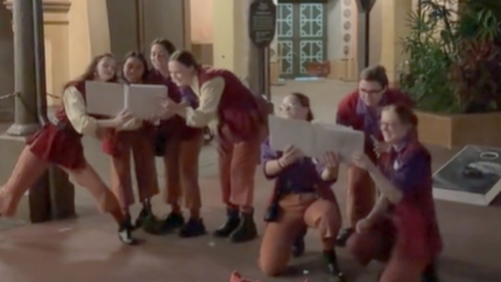 Two groups of Disney World cast members gather as they read and sing from books