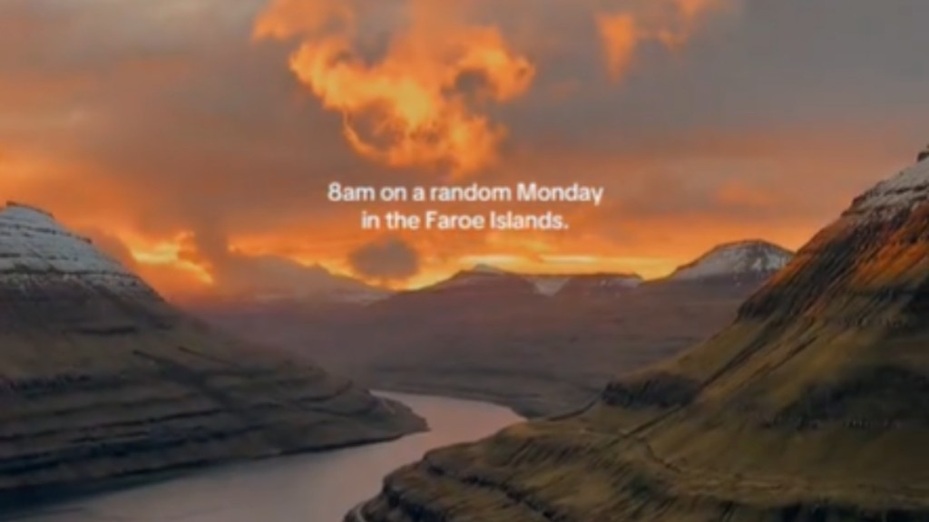 View of beautiful mountains and an orange sunset at the Faroe Islands. Text on the image: 8am on a random Monday in the Faroe Islands