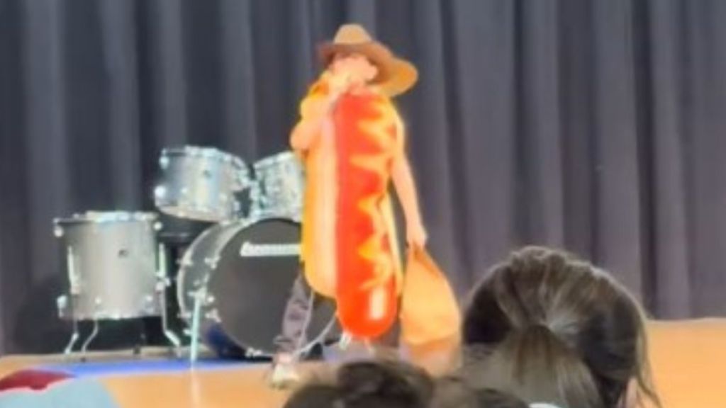 Image shows a 10-year-old singing a hot dog parody dressed like a hotdog.