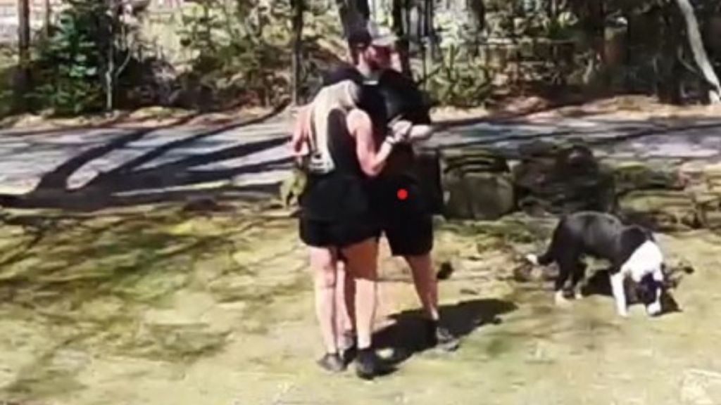 Husband stops doing yardwork to dance with his wife to their wedding song.
