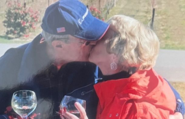 Image shows Kayla's grandparents sharing a kiss in their later years. This memory is also listed in her Grandpa's journal.