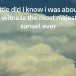 Close up of distant, massive clouds. The sky is starting to become darker as the sun sets. There is also a caption that reads "little did I know I was about to witness the most majestic sunset ever"