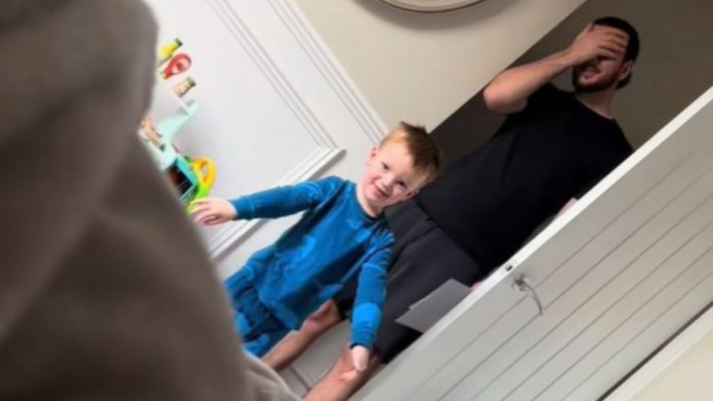 Image shows a young boy and his dad delivering a fragile gift for Mother's Day.
