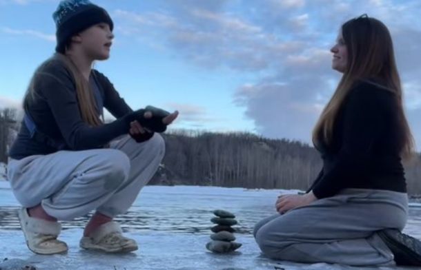 Mother and daughter build a tower of rocks focusing on the good things that have happened to them in the ending of this lesson on healing.