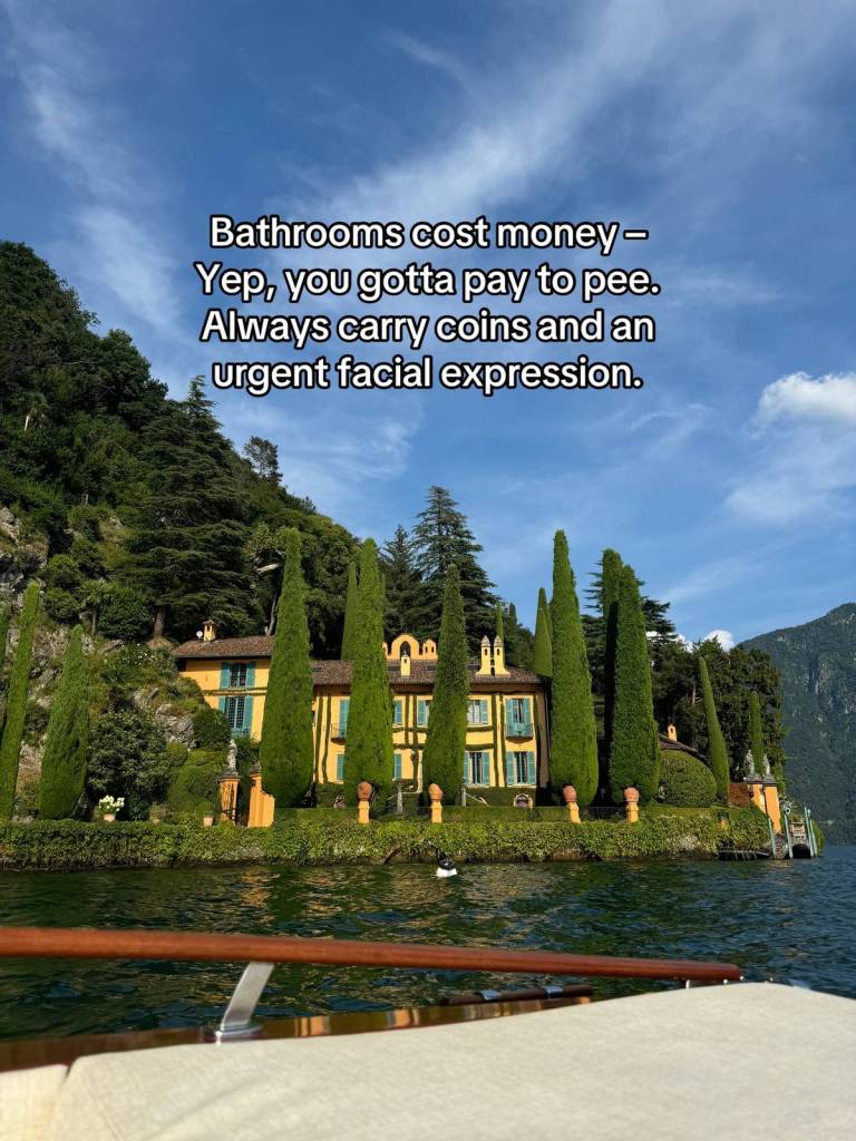 A massive home sits amidst tall, skinny trees that are taller than the home. The view is from a boat on the nearby water. Text on the image reads:
Bathrooms cost money - yep, you gotta pay to pee. Always carry coins and an urgent facial expression